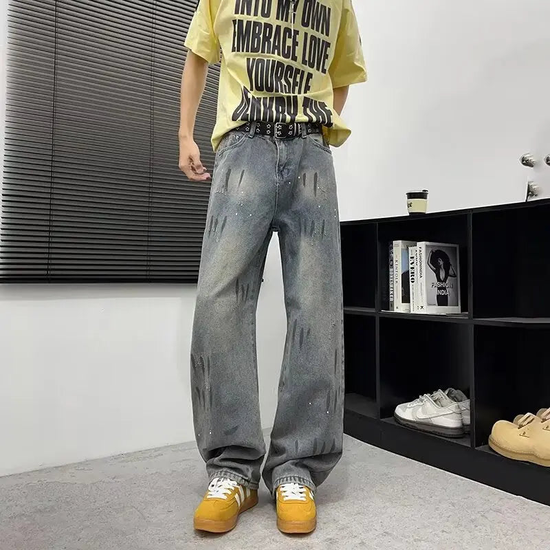 Washed and distressed splashed ink denim jeans for men Markonline