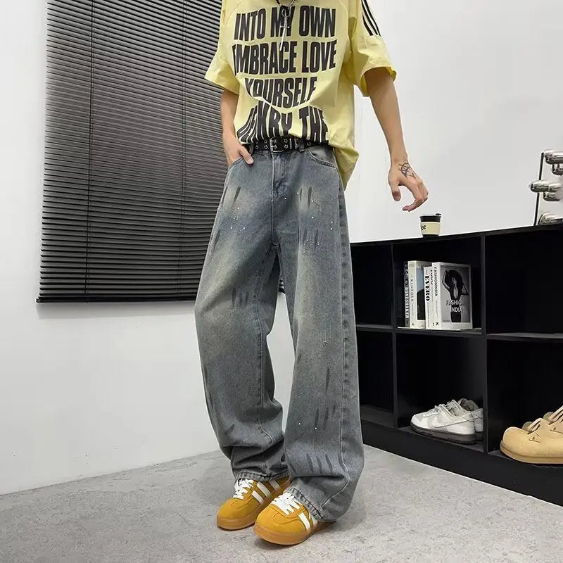 Washed and distressed splashed ink denim jeans for men Markonline