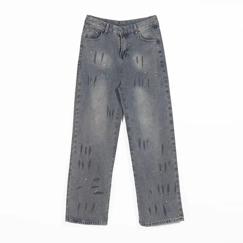 Washed and distressed splashed ink denim jeans for men Markonline